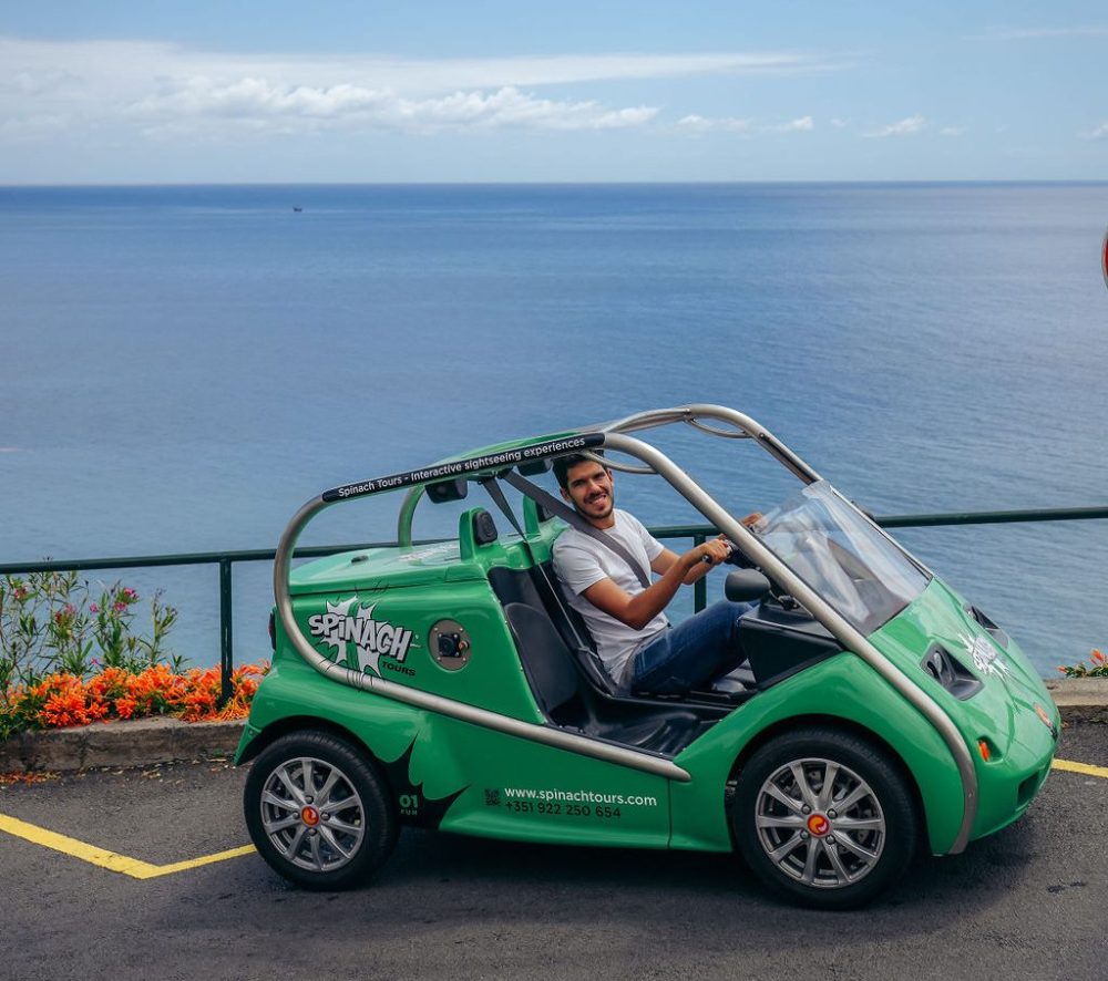 a car parked next to a body of water