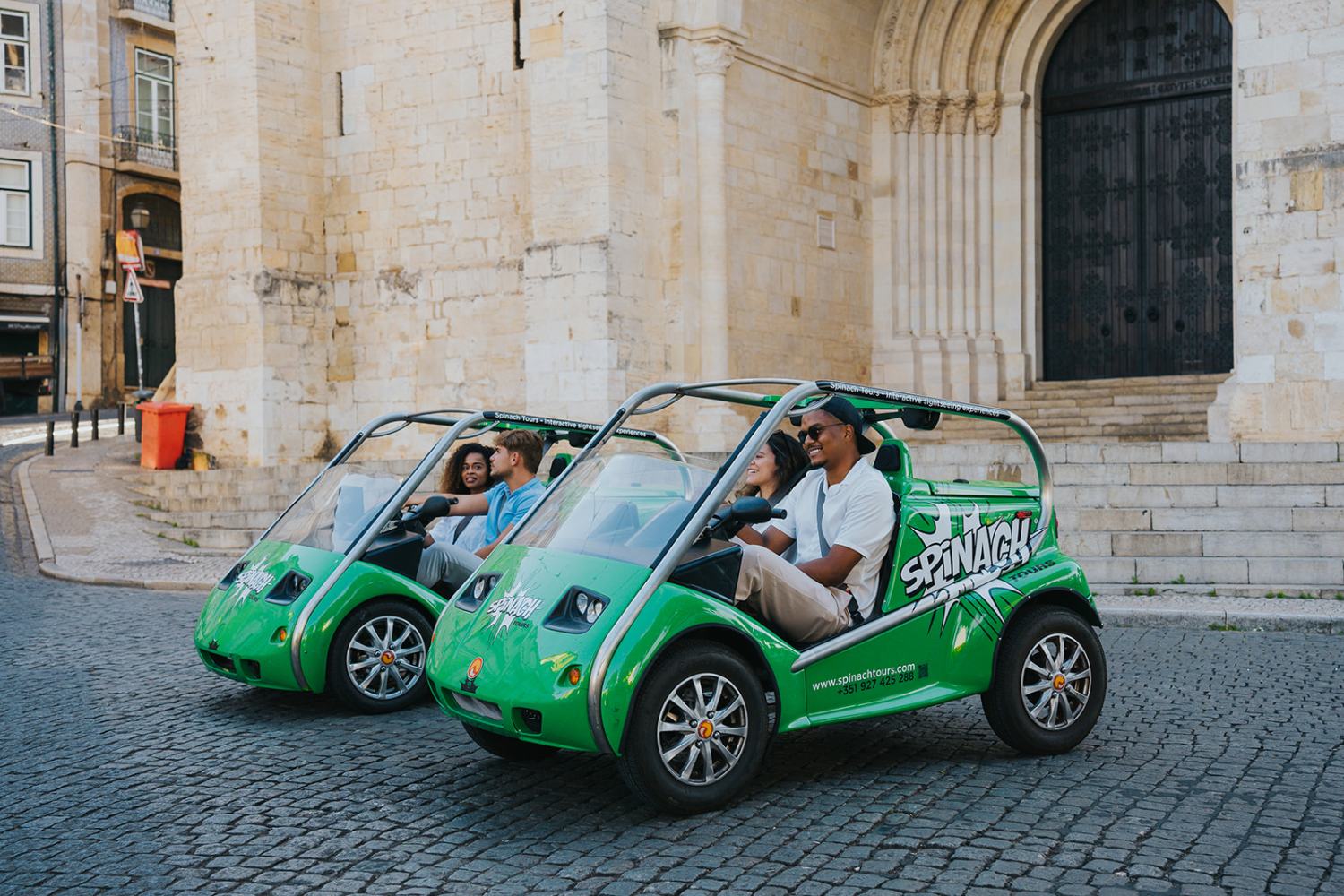 a green car parked on the side of a building